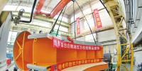 世界最大水電機(jī)組座環(huán)在哈電機(jī)整裝啟運(yùn)